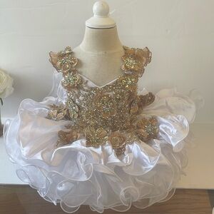 Stunning Girls holiday pageant  glitz princess glitz white and gold dress.